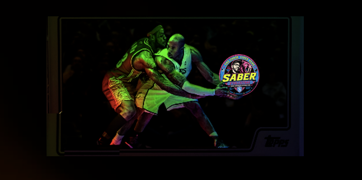 A collectible trading card featuring a basketball player in a green jersey, shown inside a dark display frame with a 'SABER' logo and a 'Topps' mark in the bottom right corner.